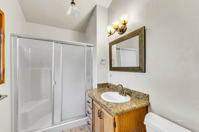 a view of a room with a large bed and closet