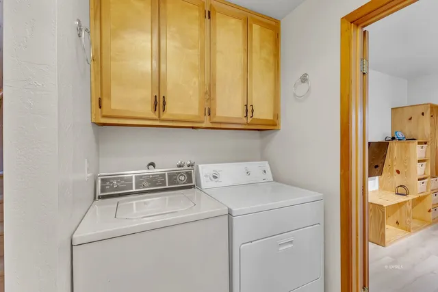 a view of a livingroom with furniture and a flat screen tv