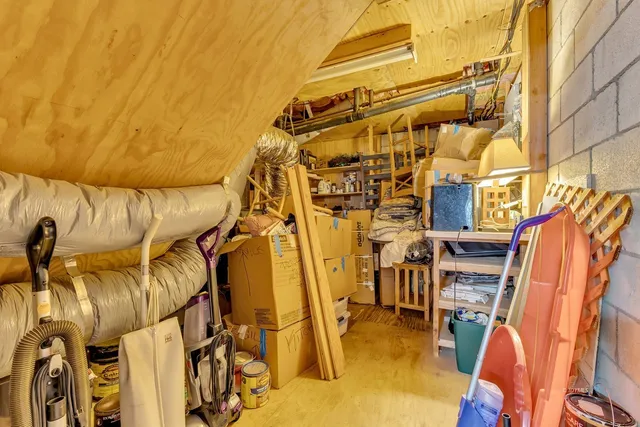 an aerial view of a house with a yard and an outdoor space
