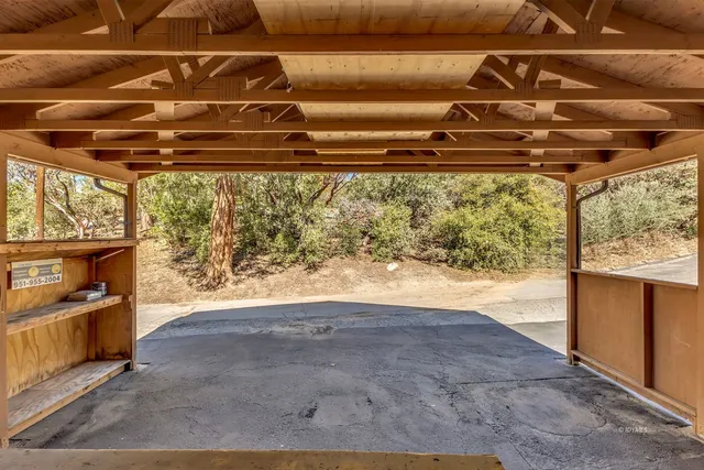 a living room with furniture gym equipment and a flat screen tv