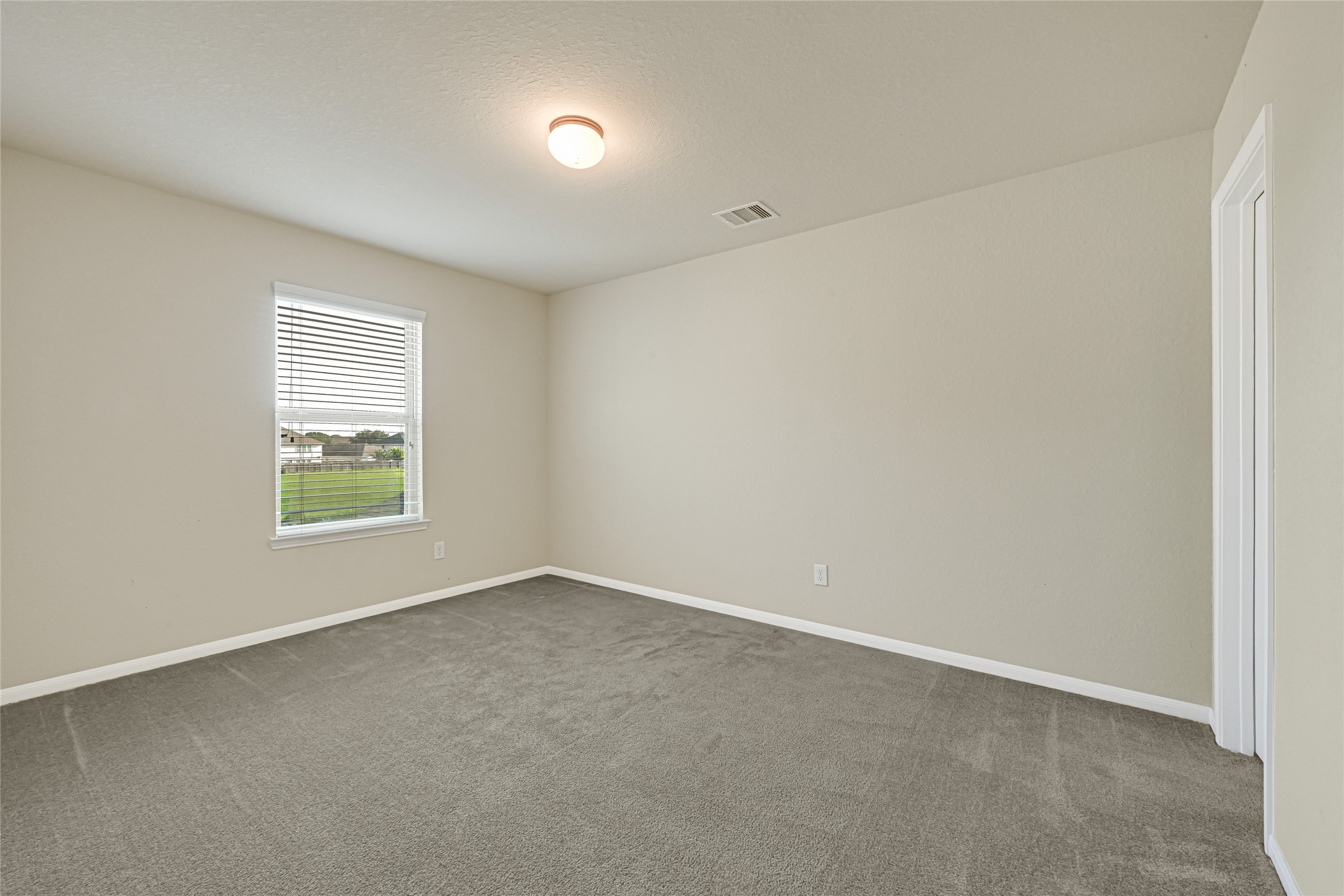 5331 Seabird Street Baytown, TX 77521 - Photo 33 of 38 an empty room with a window