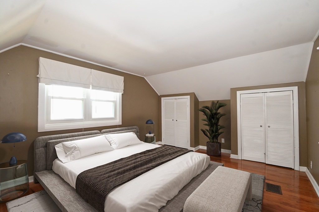 48 Porter Road Natick, MA 01760 - Photo 12 of 18 a bedroom with a bed and a window