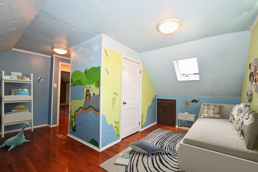 48 Porter Road Natick, MA 01760 - Photo 14 of 18 a bedroom with a bed and wooden floor