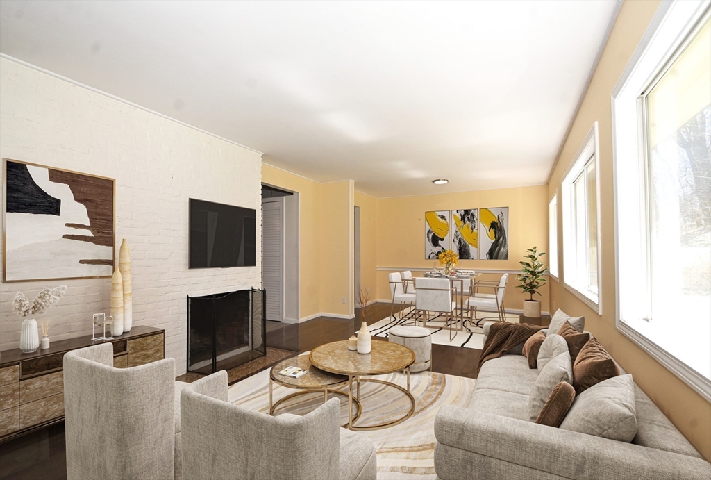 48 Porter Road Natick, MA 01760 - Photo 7 of 18 a living room with furniture a fireplace and a flat screen tv