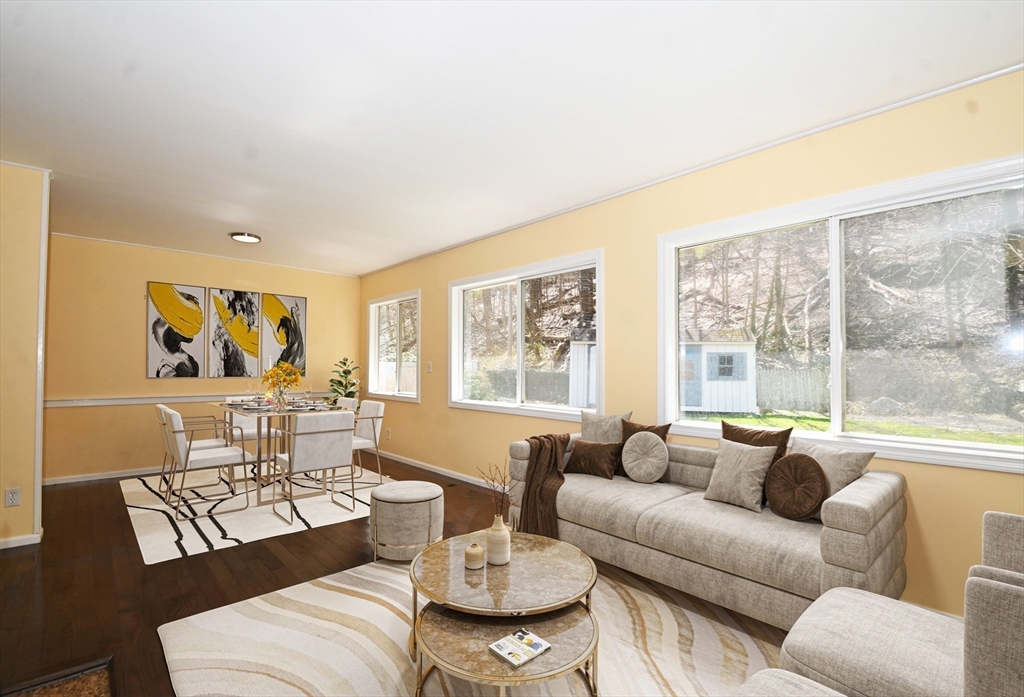 48 Porter Road Natick, MA 01760 - Photo 8 of 18 a living room with furniture and a large window