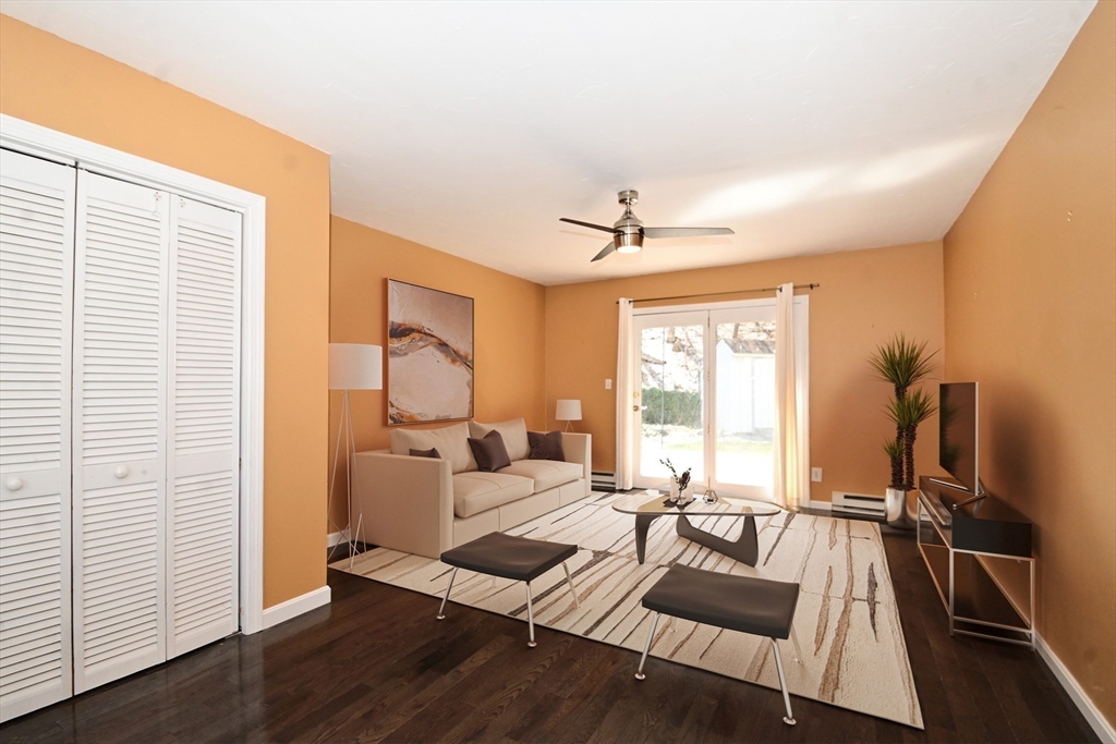 48 Porter Road Natick, MA 01760 - Photo 10 of 18 a living room with furniture and a large window