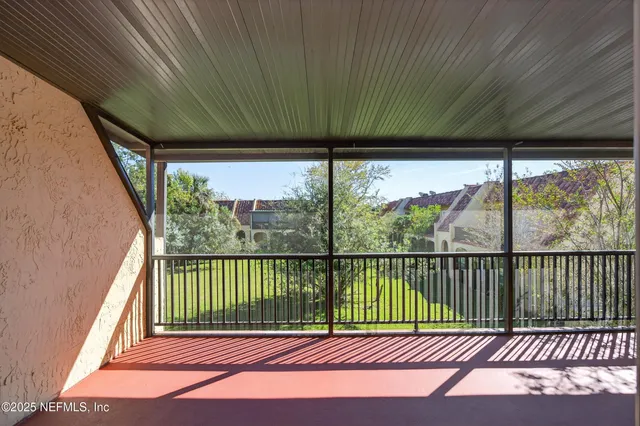 a view of a backyard with a large tree