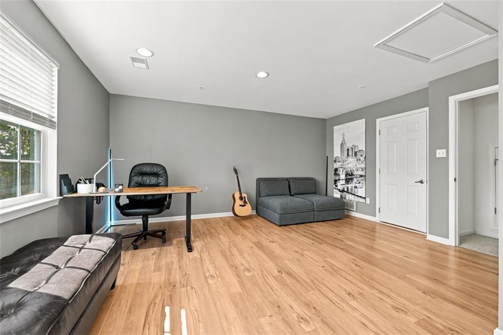 141 Lewisham Road Cranberry Township, PA 16066 - Photo 38 of 50 Gray tones, recessed lighting and windows that overlook the private views behind make this a space you will truly enjoy.