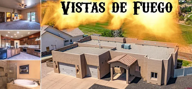 a view of a patio with table and chairs under an umbrella