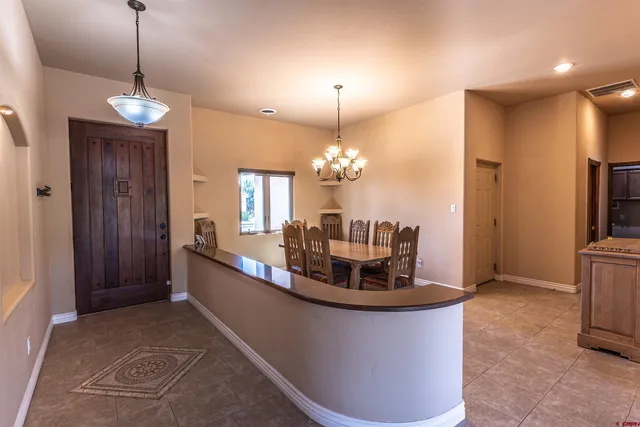 a view of a dining room with a chandelier