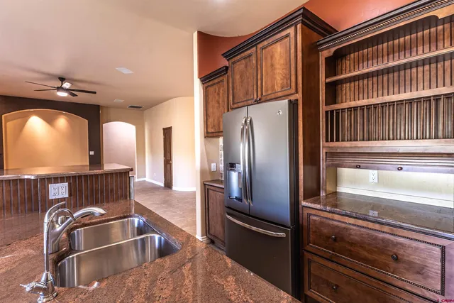 a kitchen with a refrigerator and a sink
