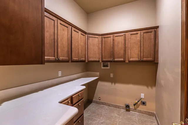 a room with a chair and painted walls