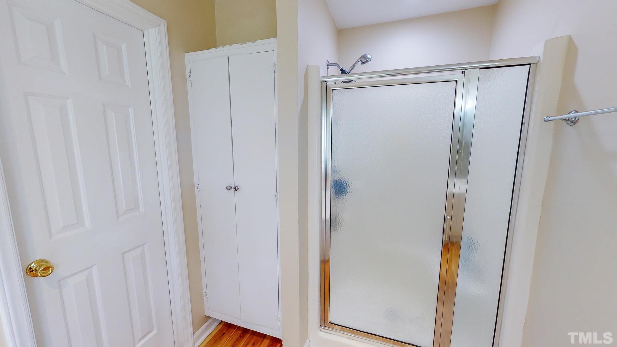 159 Punch Hill Farm Road Rougemont, NC 27572 - Photo 15 of 43 a bathroom with a glass shower door