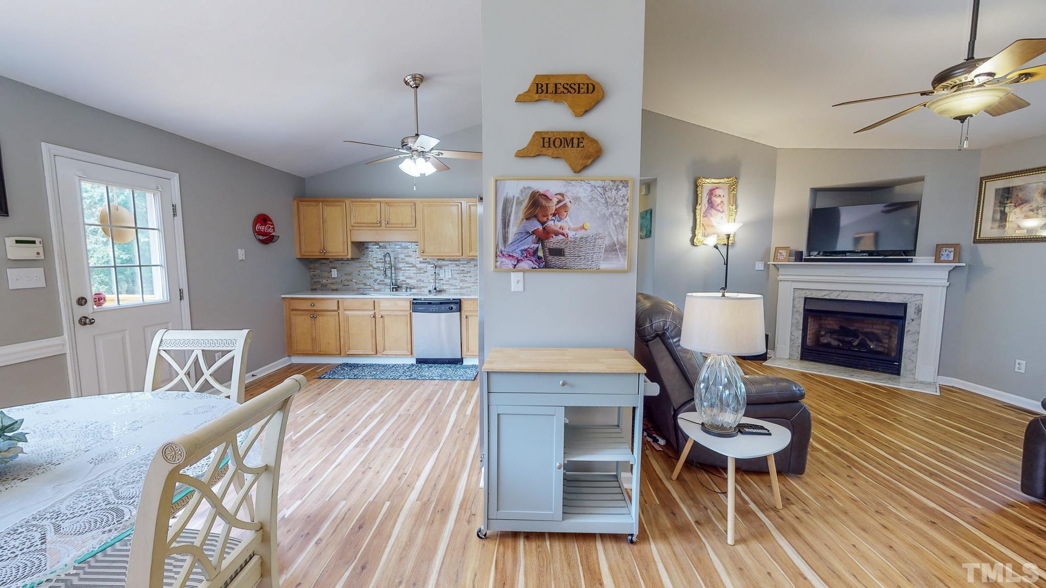 159 Punch Hill Farm Road Rougemont, NC 27572 - Photo 22 of 43 a living room with furniture fireplace and dining table