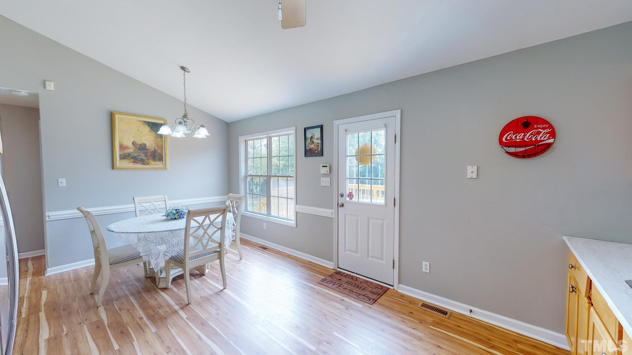 159 Punch Hill Farm Road Rougemont, NC 27572 - Photo 26 of 43 a view of a dining room with furniture and wooden floor