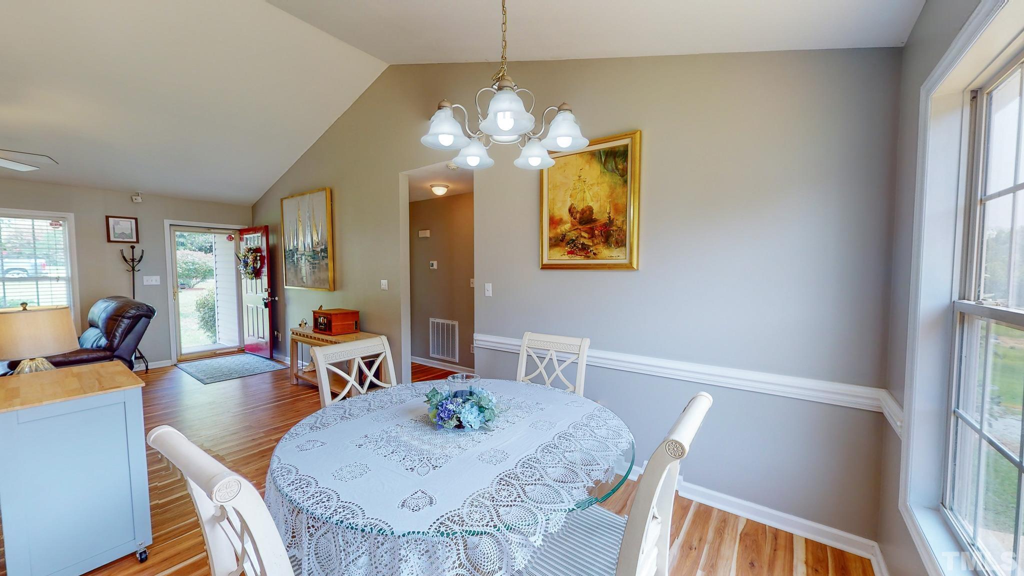 159 Punch Hill Farm Road Rougemont, NC 27572 - Photo 27 of 43 a view of a dining room with furniture and wooden floor