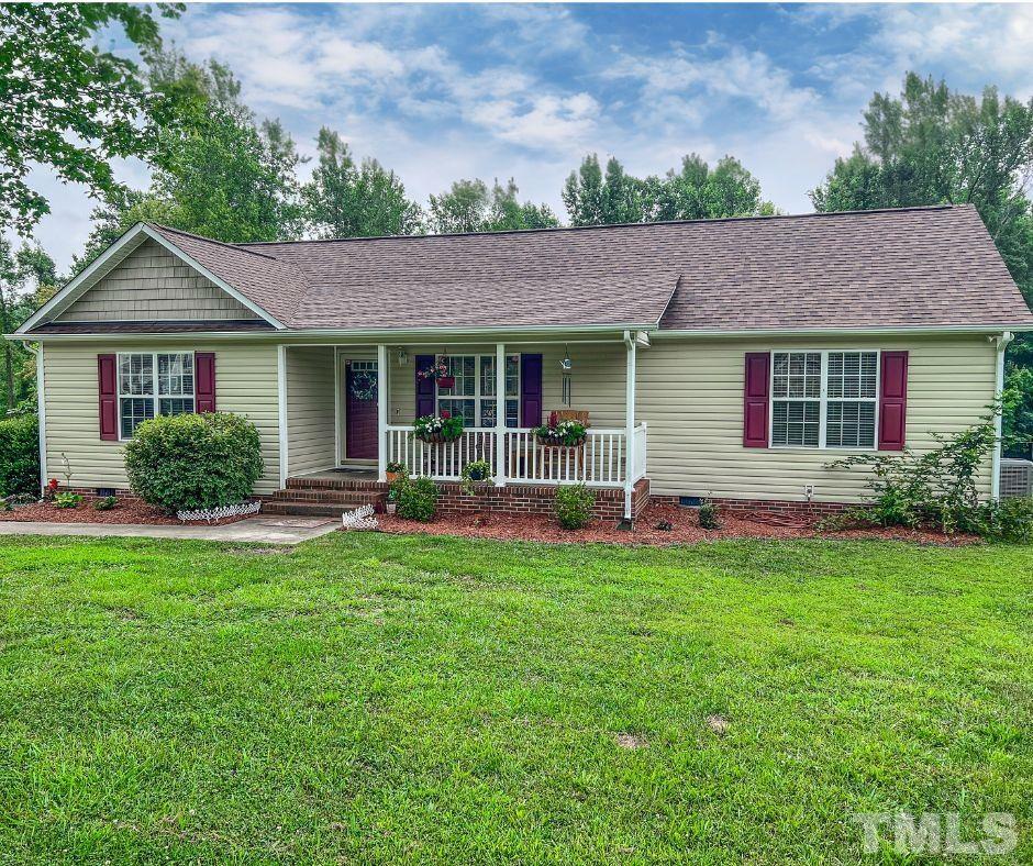 159 Punch Hill Farm Road Rougemont, NC 27572 - Photo 42 of 43 a backyard of a house with table and chairs