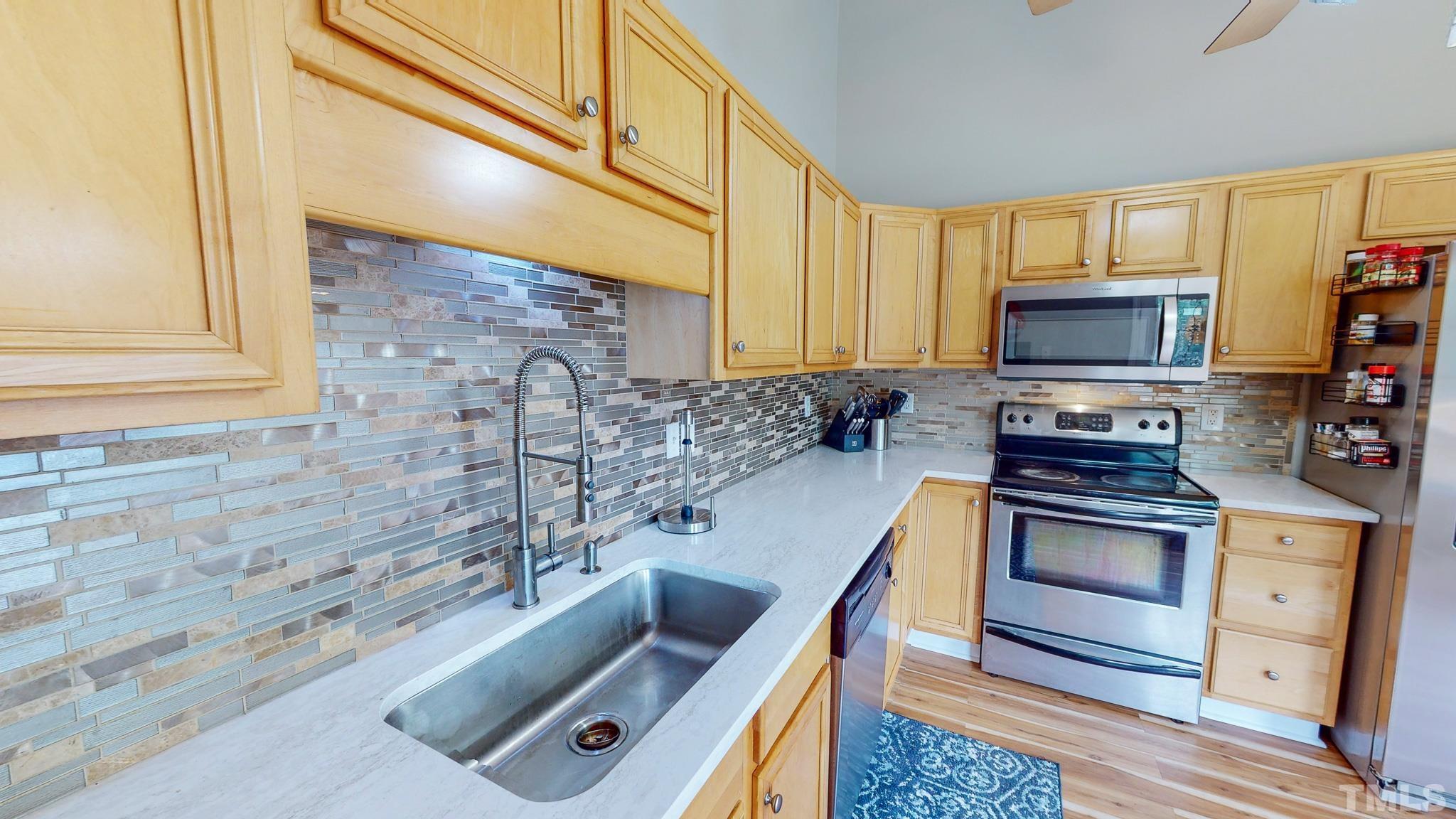 159 Punch Hill Farm Road Rougemont, NC 27572 - Photo 5 of 43 a kitchen with granite countertop a stove and a sink