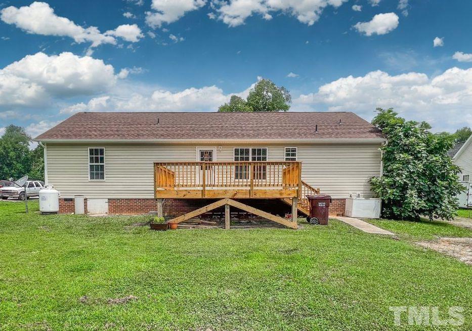 159 Punch Hill Farm Road Rougemont, NC 27572 - Photo 6 of 43 a front view of a house with garden