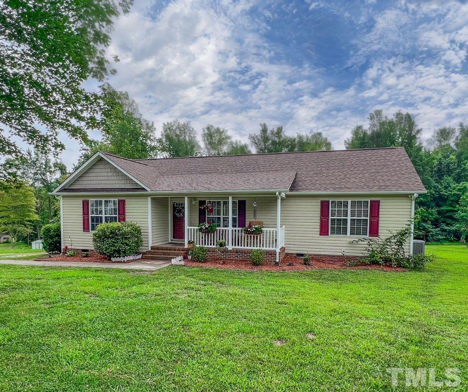 159 Punch Hill Farm Road Rougemont, NC 27572 - Photo 7 of 43 a front view of a house with garden and porch