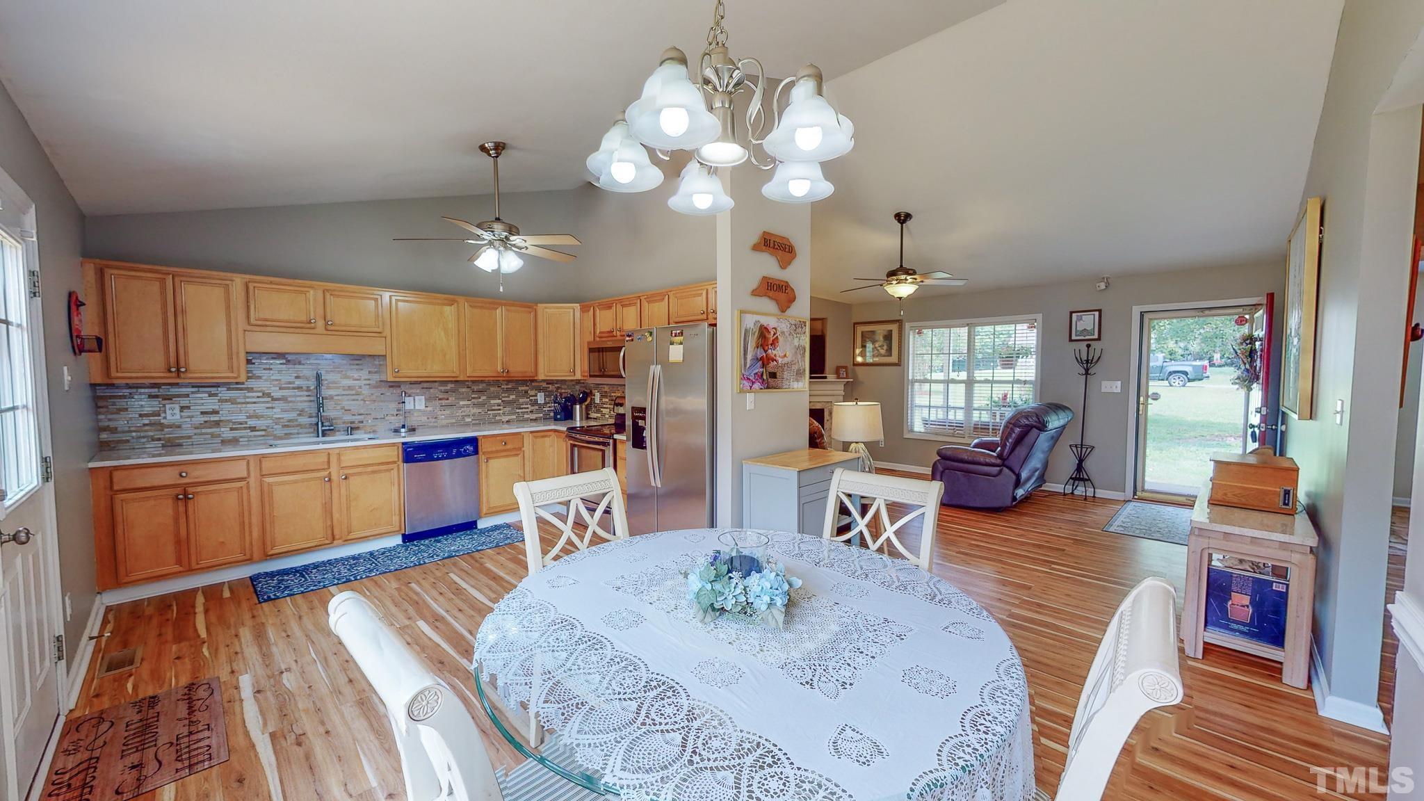 159 Punch Hill Farm Road Rougemont, NC 27572 - Photo 8 of 43 a view of a dining room with furniture and wooden floor
