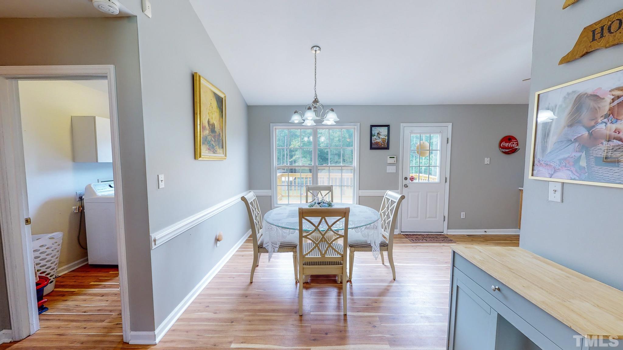 159 Punch Hill Farm Road Rougemont, NC 27572 - Photo 9 of 43 a view of a dining room with furniture window and wooden floor