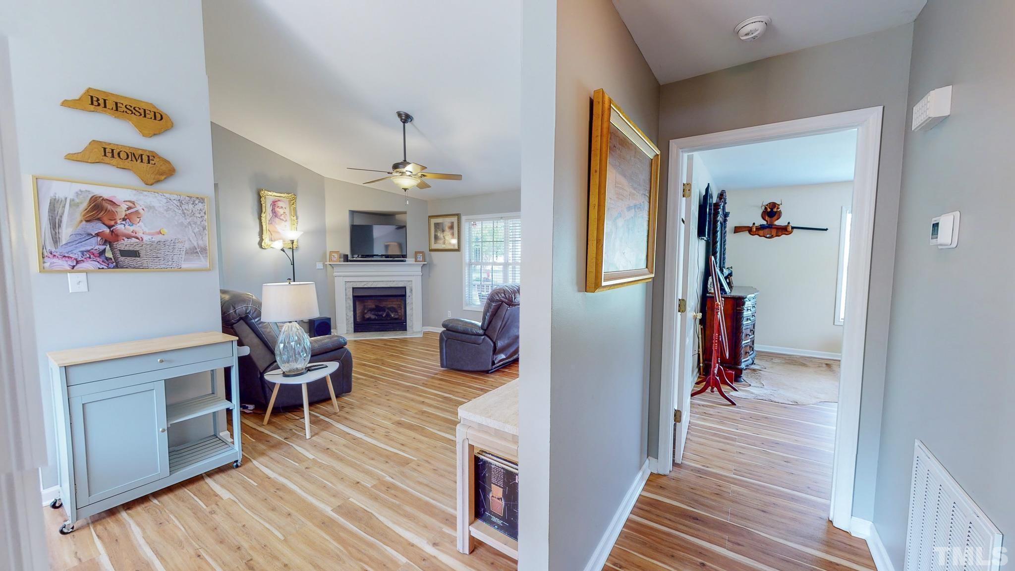159 Punch Hill Farm Road Rougemont, NC 27572 - Photo 10 of 43 a living room with furniture and a fireplace