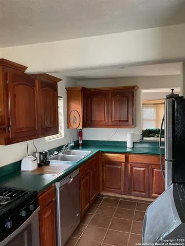 a view of a kitchen with windows