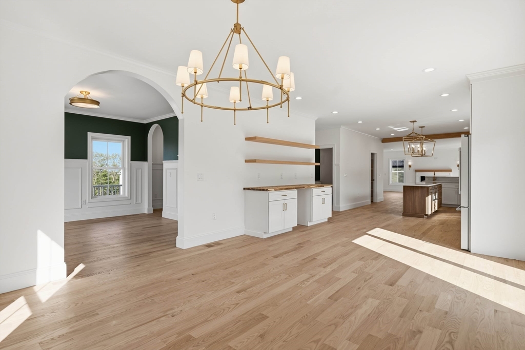 16 Couture Way Middleton, MA 01949 - Photo 14 of 36 a view of a kitchen with wooden floor and a chandelier