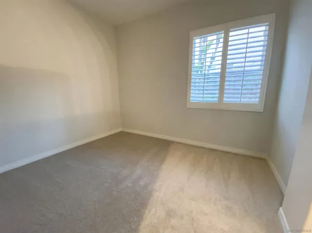 a white toilet sitting next to a bath tub