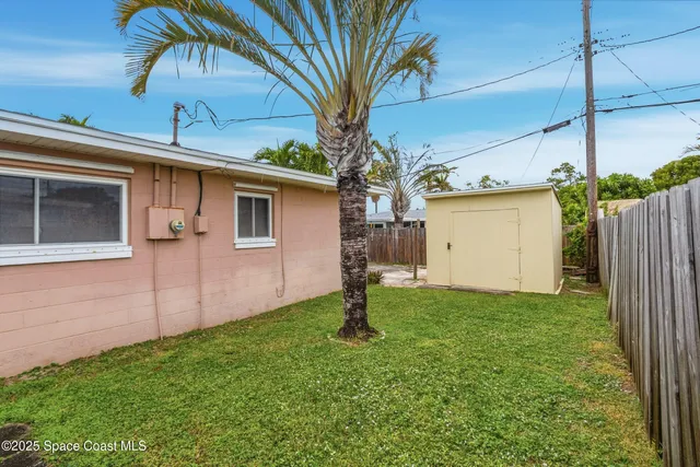a backyard of a house with lots of green space