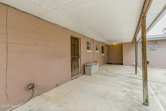 a kitchen with granite countertop a sink stove and cabinets