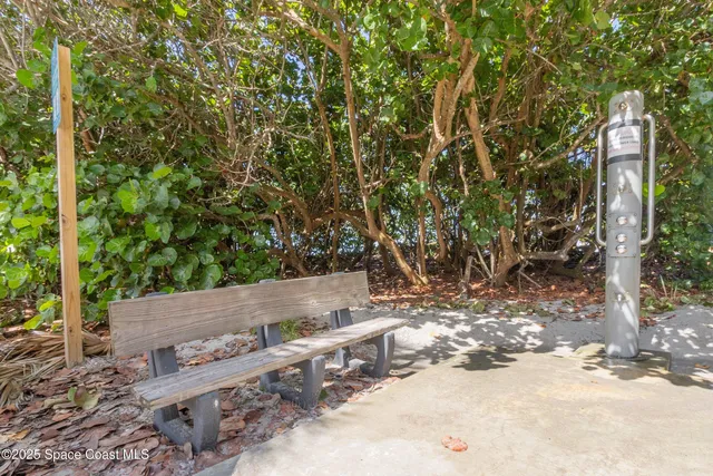 a view of water heater and covered with wooden fence
