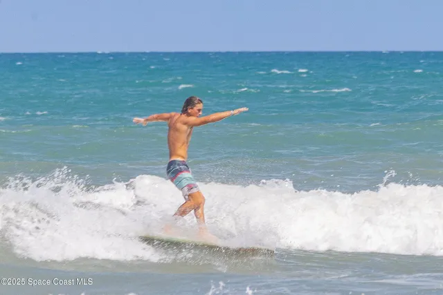 a view of balcony with couch and wooden floor