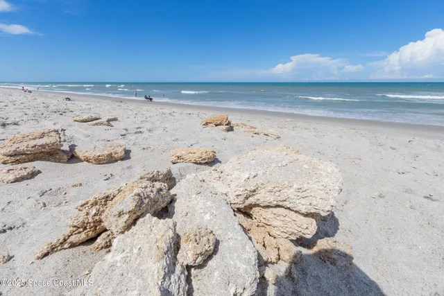 a view of a balcony with wooden floor