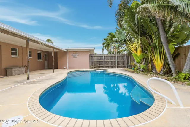 a view of a swimming pool with an outdoor space