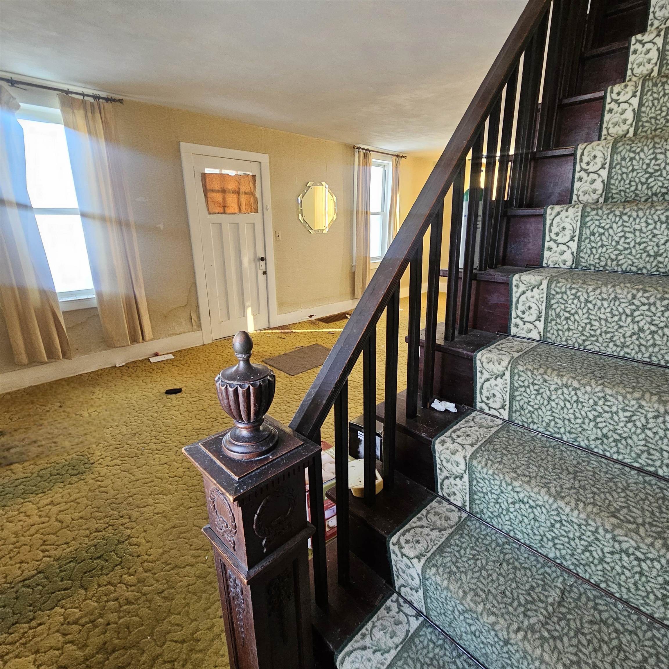 9202 Town Hall Road Belvidere, IL 61008 - Photo 36 of 39 a dining room with wooden floor and stairs