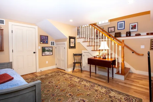 a living room with furniture and a book shelf