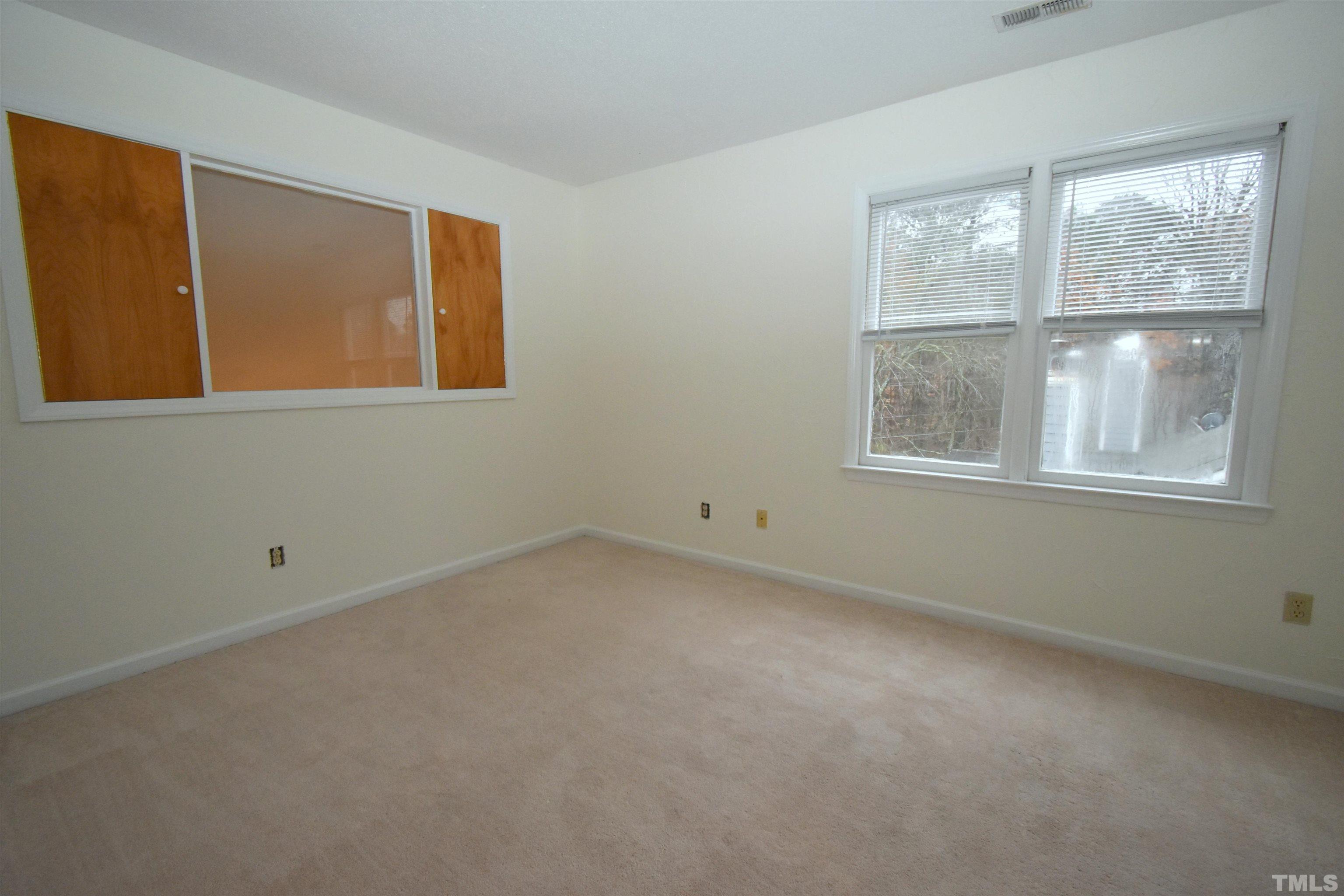 625 Windsong Lane Durham, NC 27713 - Photo 21 of 34 an empty room with windows