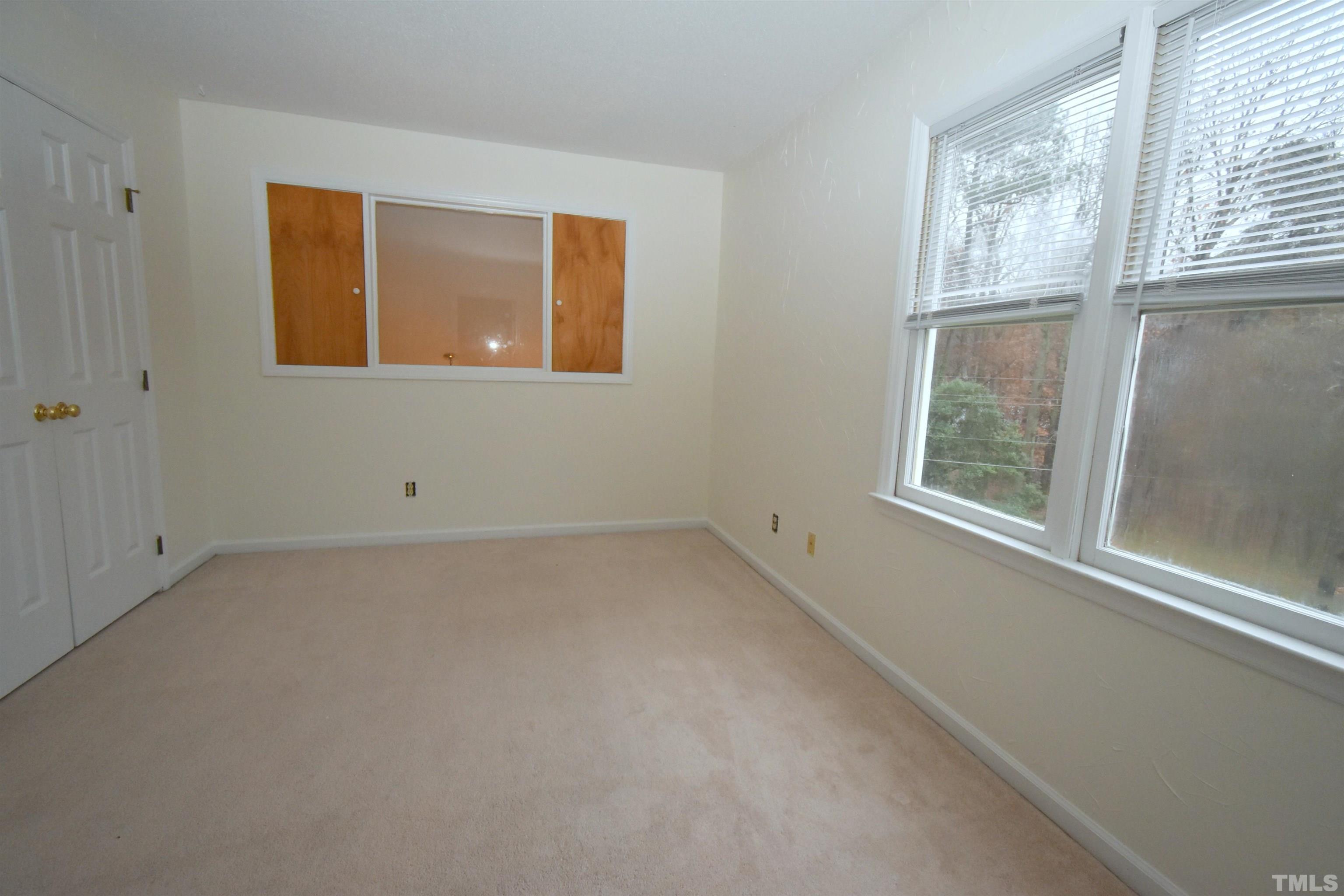 625 Windsong Lane Durham, NC 27713 - Photo 22 of 34 an empty room with windows