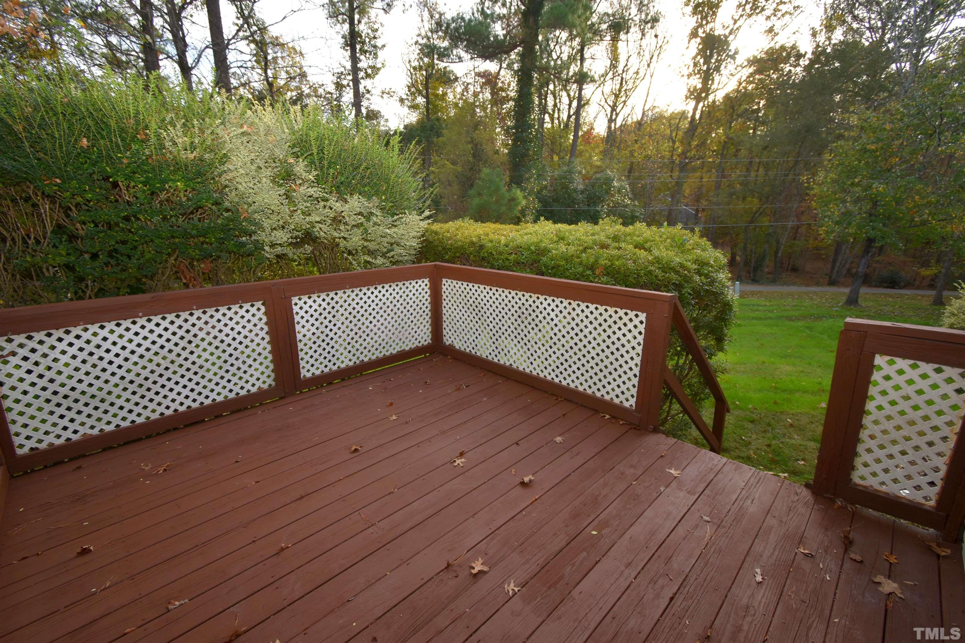 625 Windsong Lane Durham, NC 27713 - Photo 29 of 34 a view of wooden floor and trees in the backyard