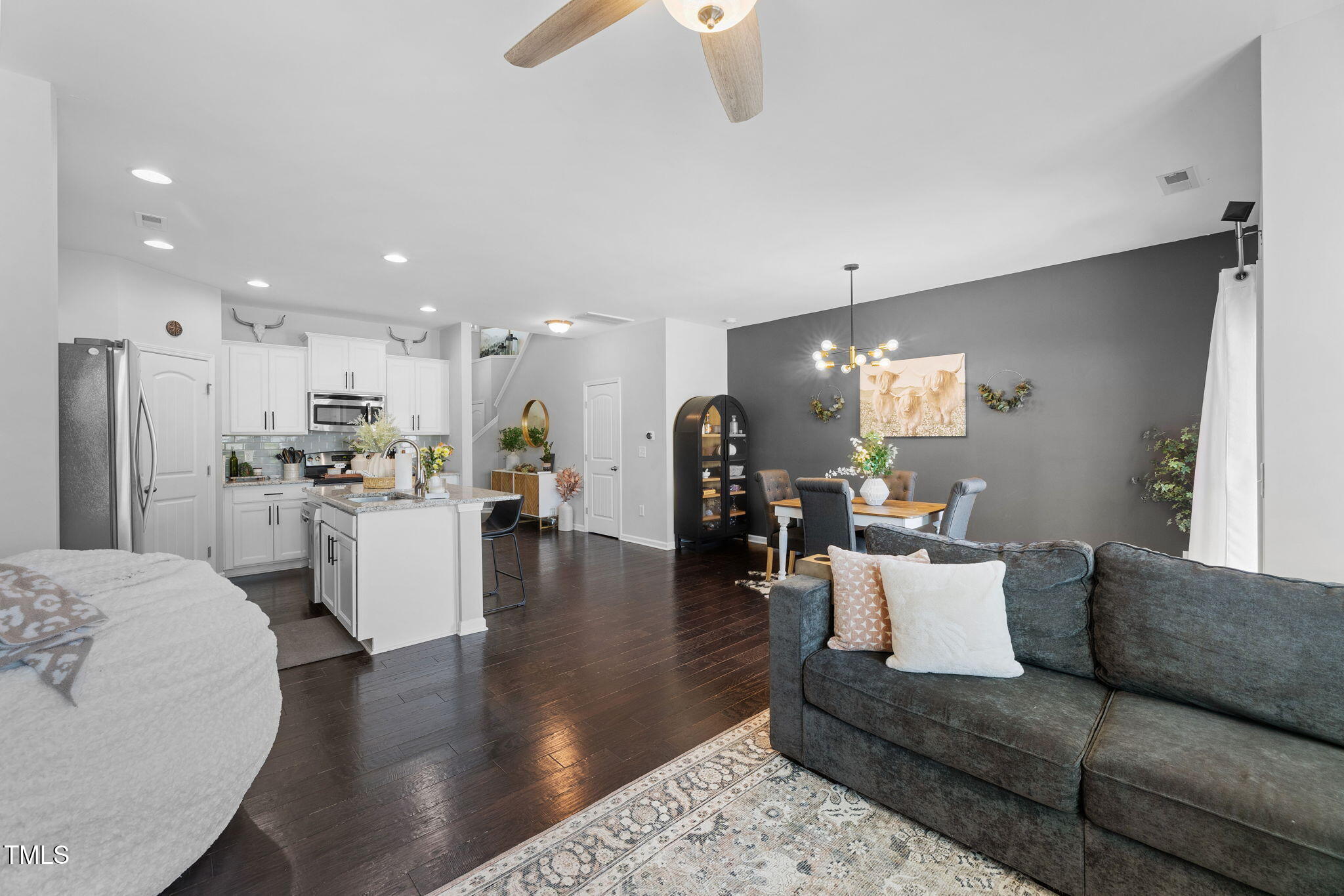 7807 Elmshire Way Raleigh, NC 27616 - Photo 15 of 32 a living room with furniture and kitchen view