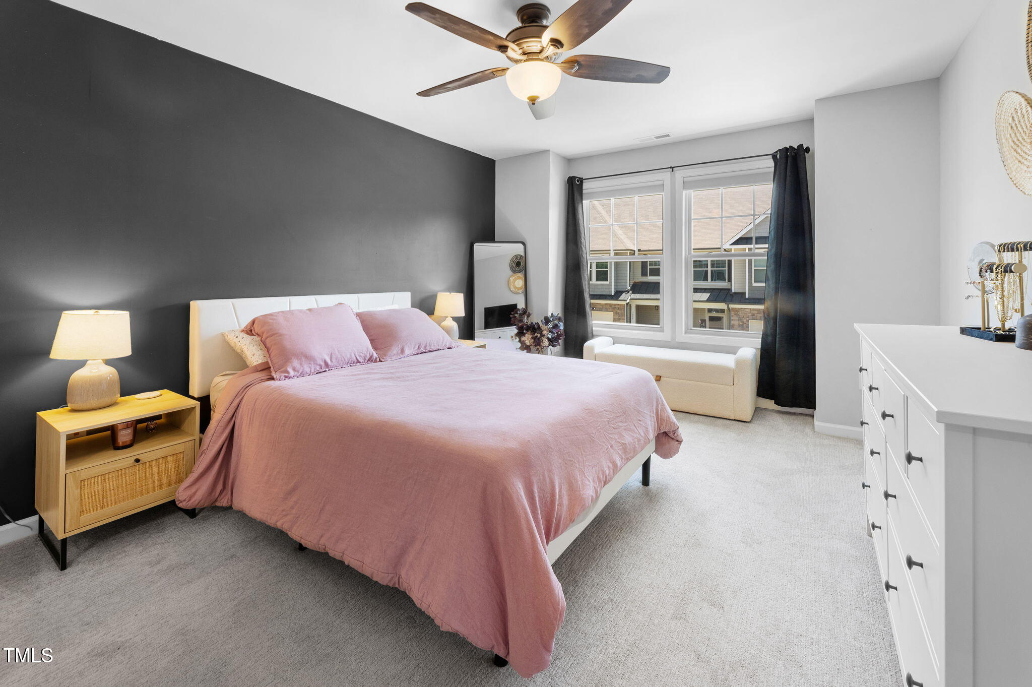 7807 Elmshire Way Raleigh, NC 27616 - Photo 18 of 32 a spacious bedroom with a bed and a chandelier