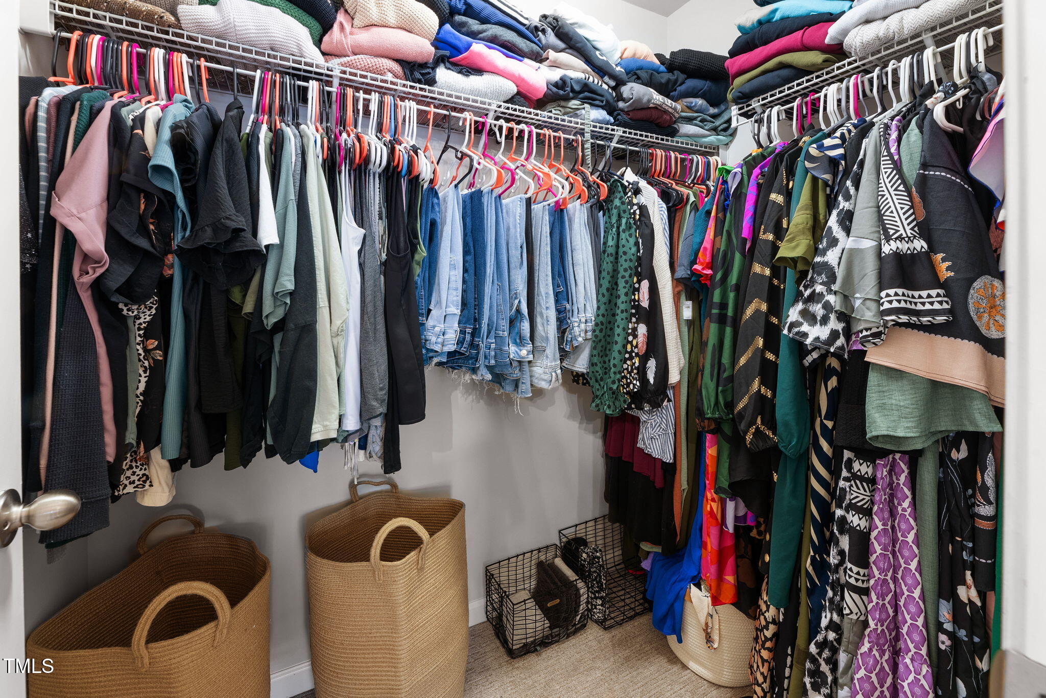 7807 Elmshire Way Raleigh, NC 27616 - Photo 24 of 32 a view of walk in closet with clothes and shoes