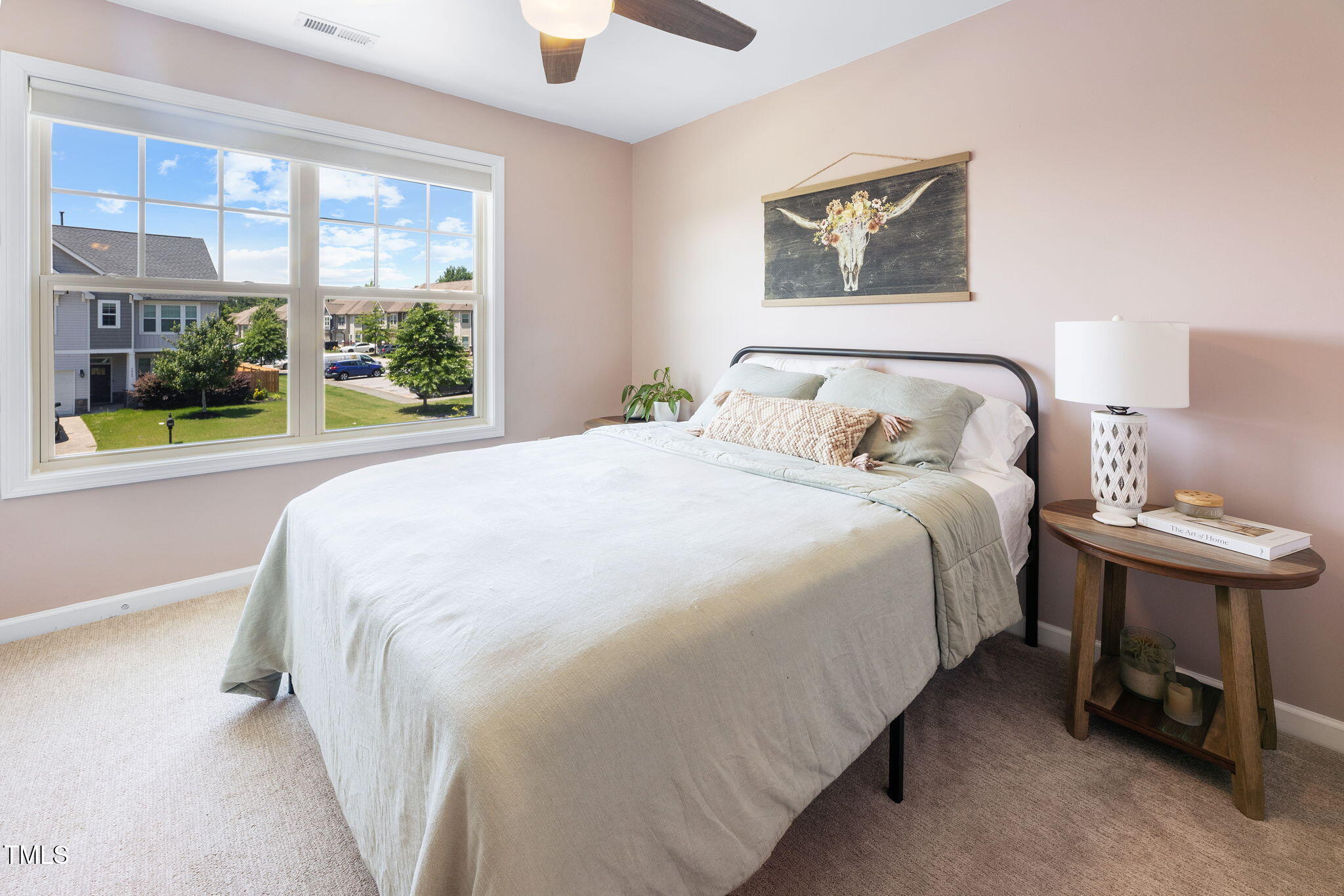 7807 Elmshire Way Raleigh, NC 27616 - Photo 29 of 32 a large bed sitting in a bedroom next to a window