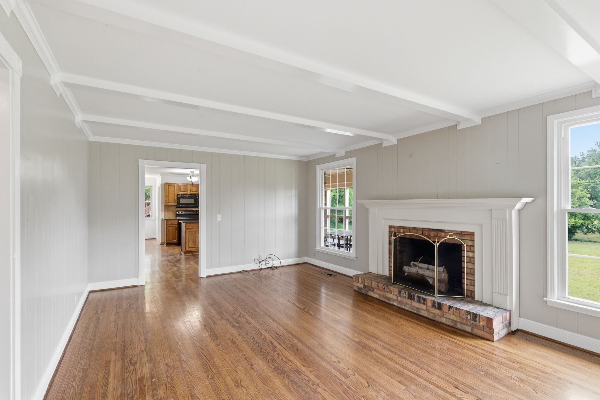 213 Rising Sun Lane Old Hickory, TN 37138 - Photo 11 of 37 a view of an empty room with wooden floor fireplace and a window