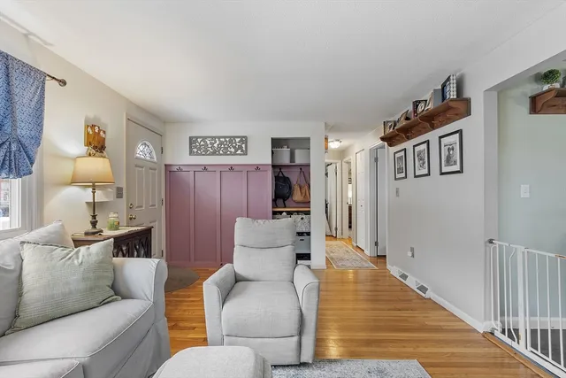 a living room with furniture and a lamp