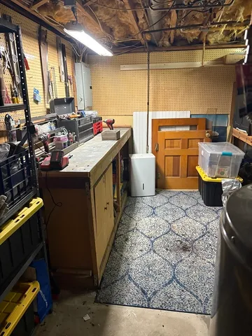 a kitchen with a sink and wooden cabinets