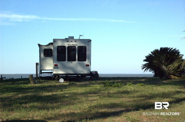 8599 West Fort Morgan Road West Gulf Shores, AL 36542 - Photo 5 of 17 camper and half the lot