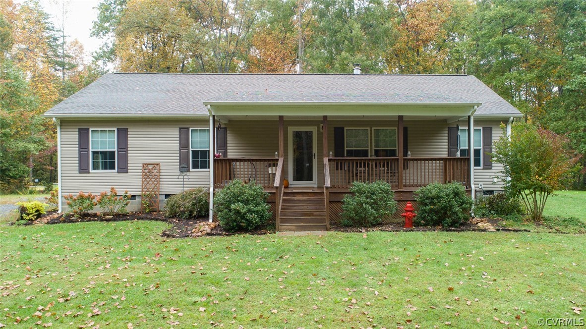 5764 Community House Road Columbia, VA 23038 - Photo 1 of 48 a view of a house with brick walls and a yard with plants